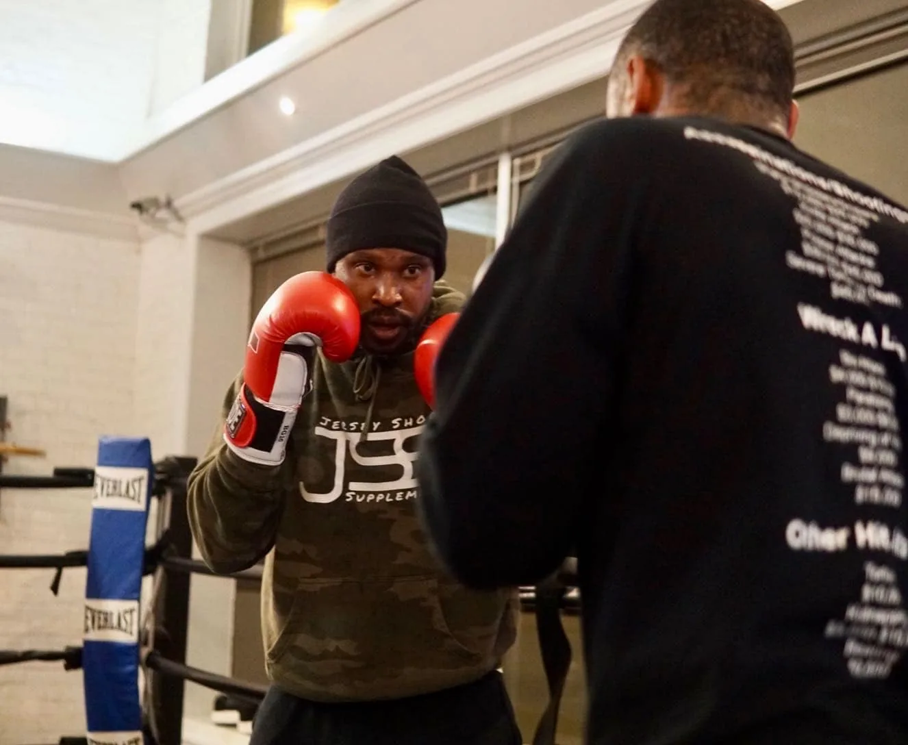Member working the heavy bag during a Vintage Boxing class